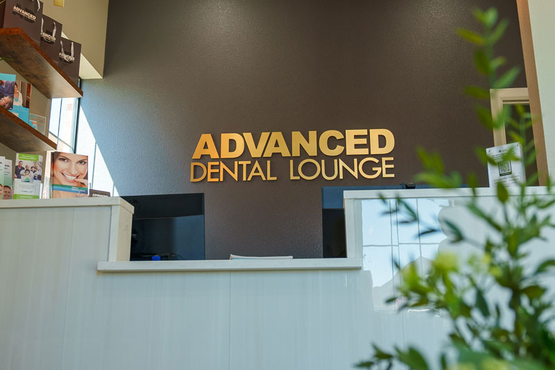 The front desk and reception area inside Advanced Dental Lounge & Implants
