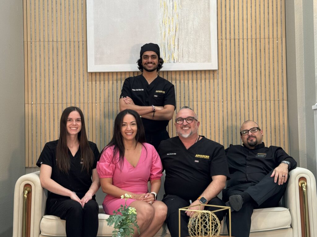 The Advanced Dental Lounge & Implants team together in the office
